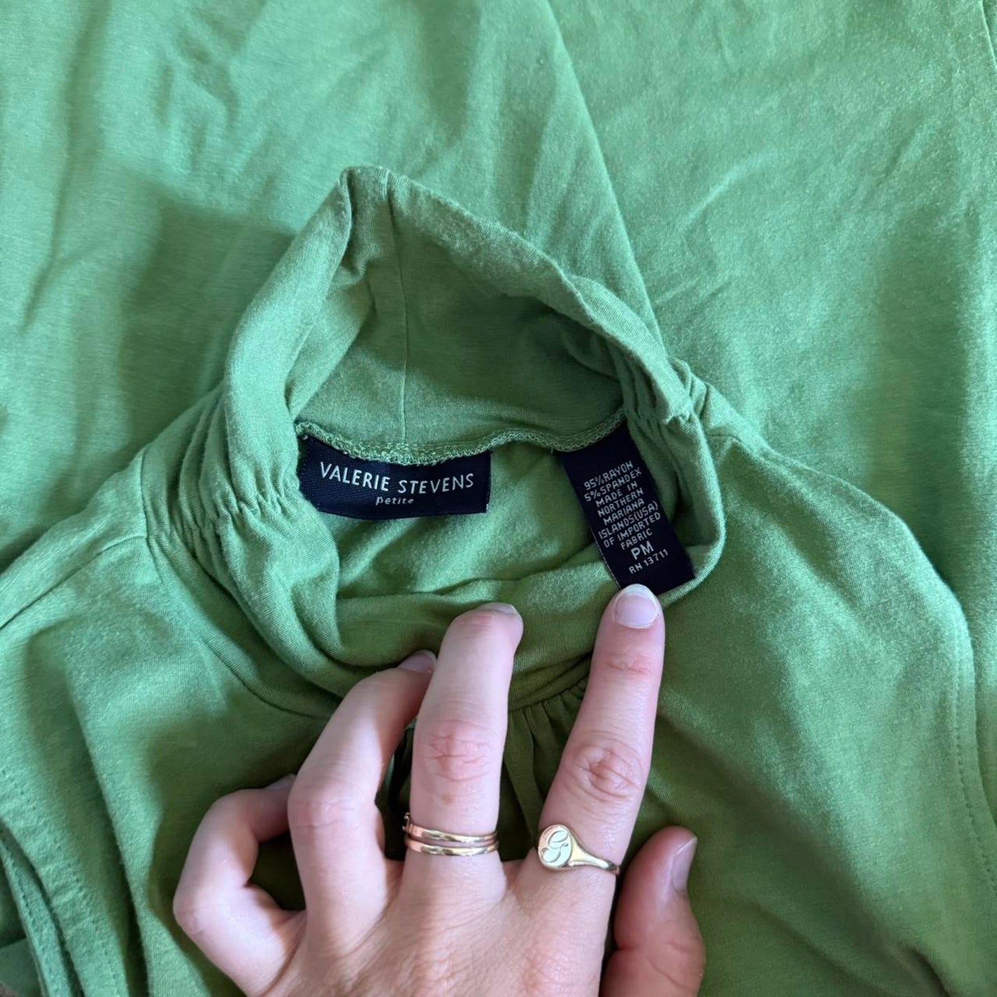 Green silk turtleneck top