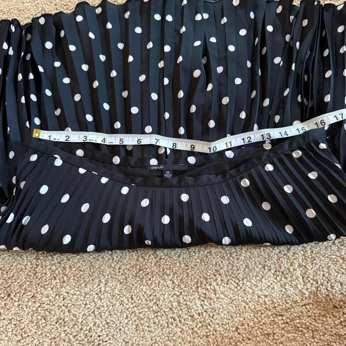 Black and white polka dot pleated midi skirt